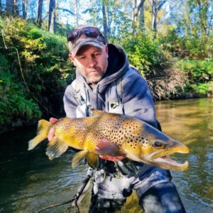 Miles holding a trout|Ngongotaha Stream |Paradise Valley Lodge